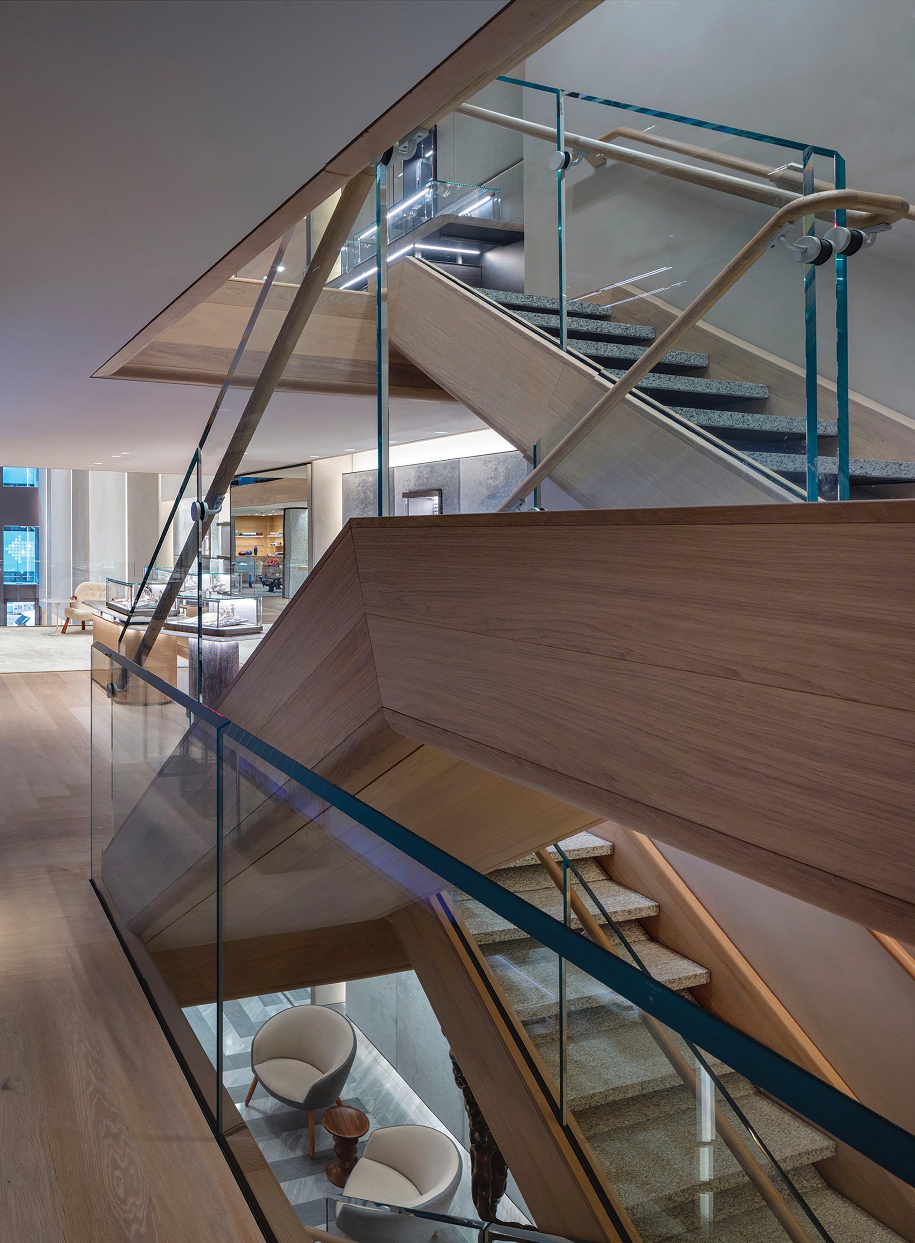 The main staircase’s glass-paneled design was influenced by the brand’s new Creative Director, Evan Yurman.