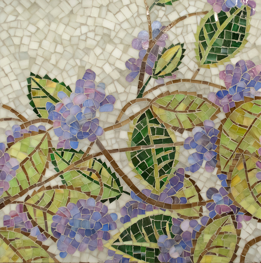 Hydrangea, a hand-cut glass mosaic shown in Rhodolite, Schist, Ametrine, Cat’s Eye, Peridot, Iolite jewel glass with Alabaster Sea Glass, is part of the Natural Selections Collection by Kevin O’Brien for New Ravenna.