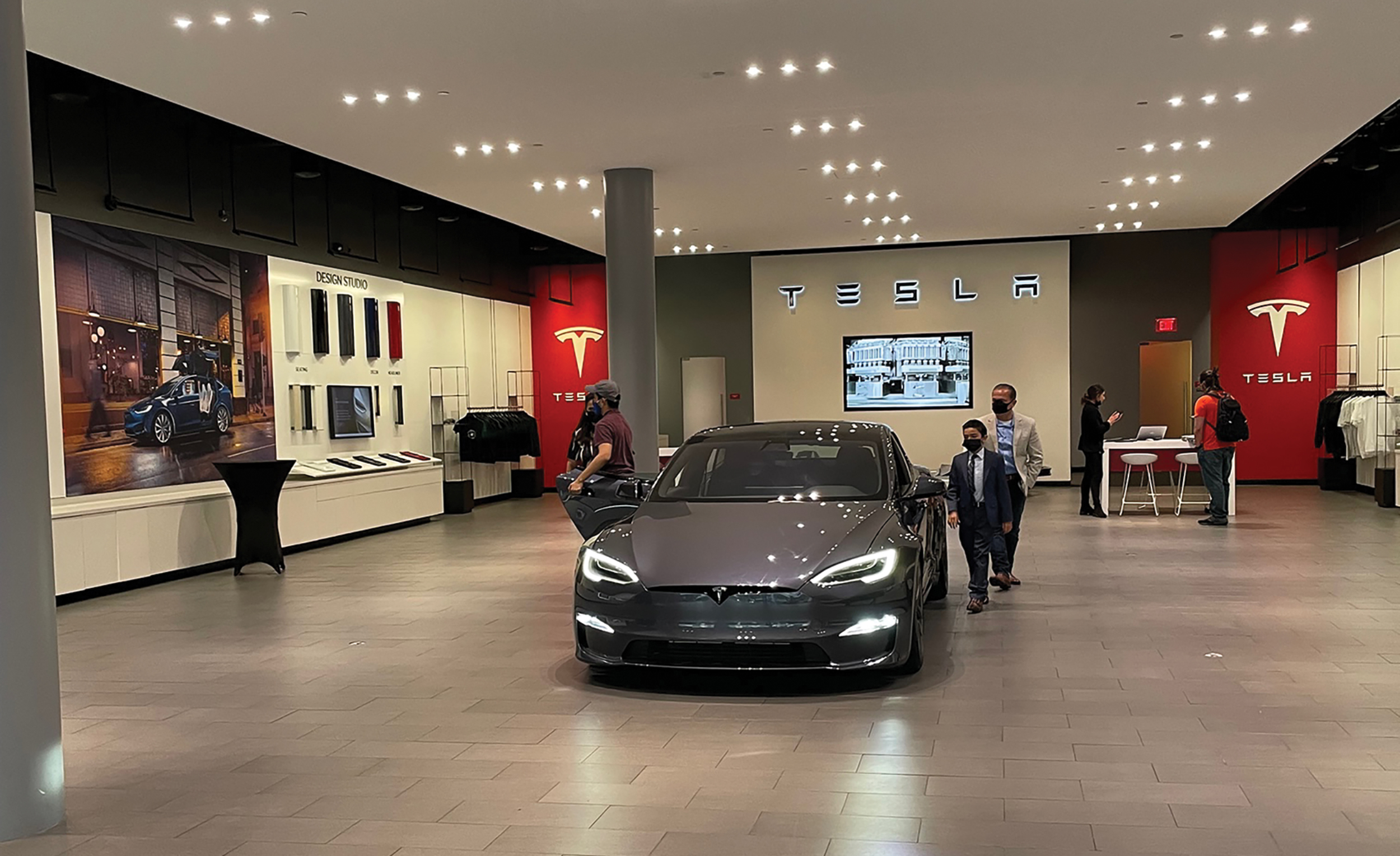 Tesla’s Santana Row showroom includes strong messaging and an on-brand color scheme.