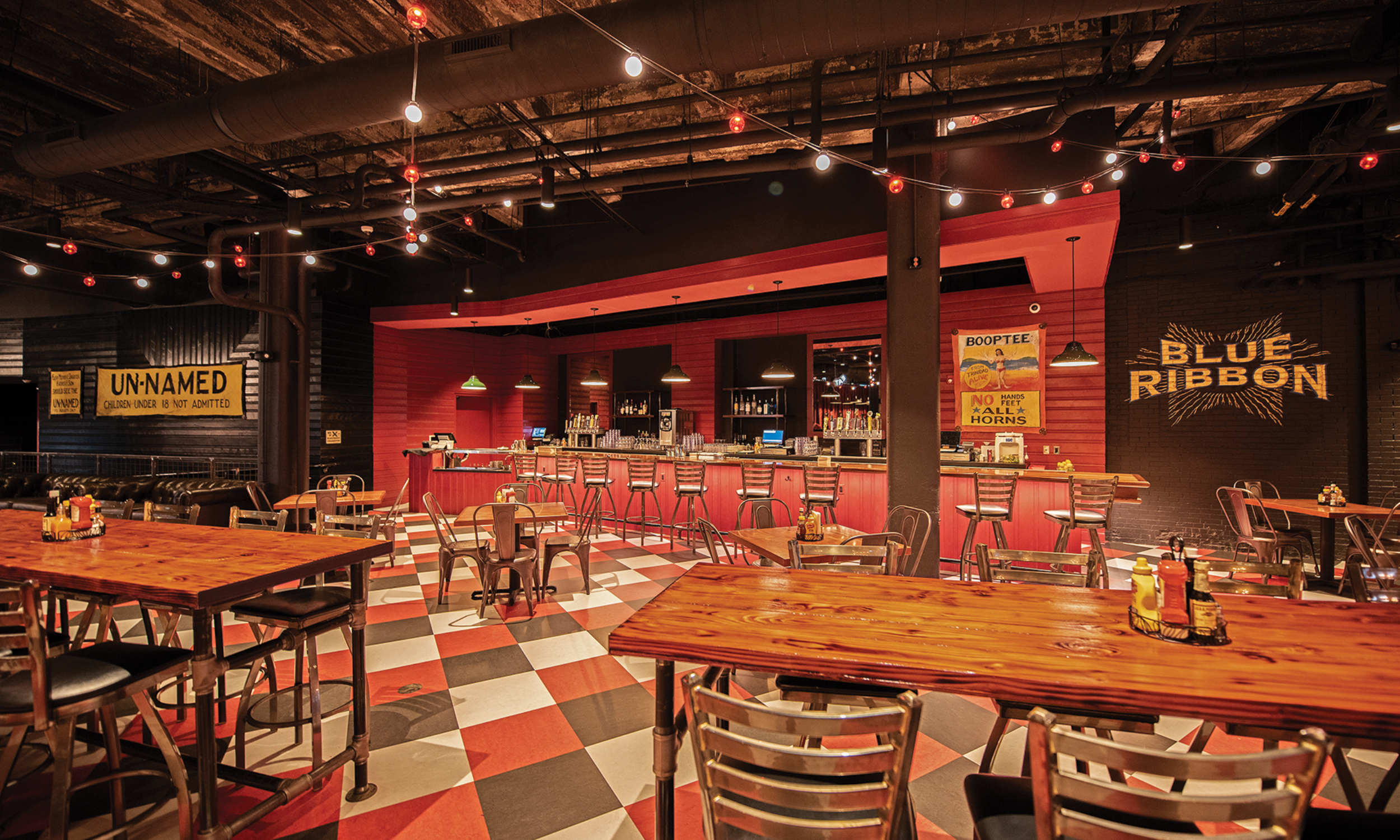 ABOVE: In addition to bowling and live music, patrons visiting Brooklyn Bowl can grab a bite to eat or sip a cocktail in the 52,000-square-foot space, at one point home to an auto manufacturing plant.