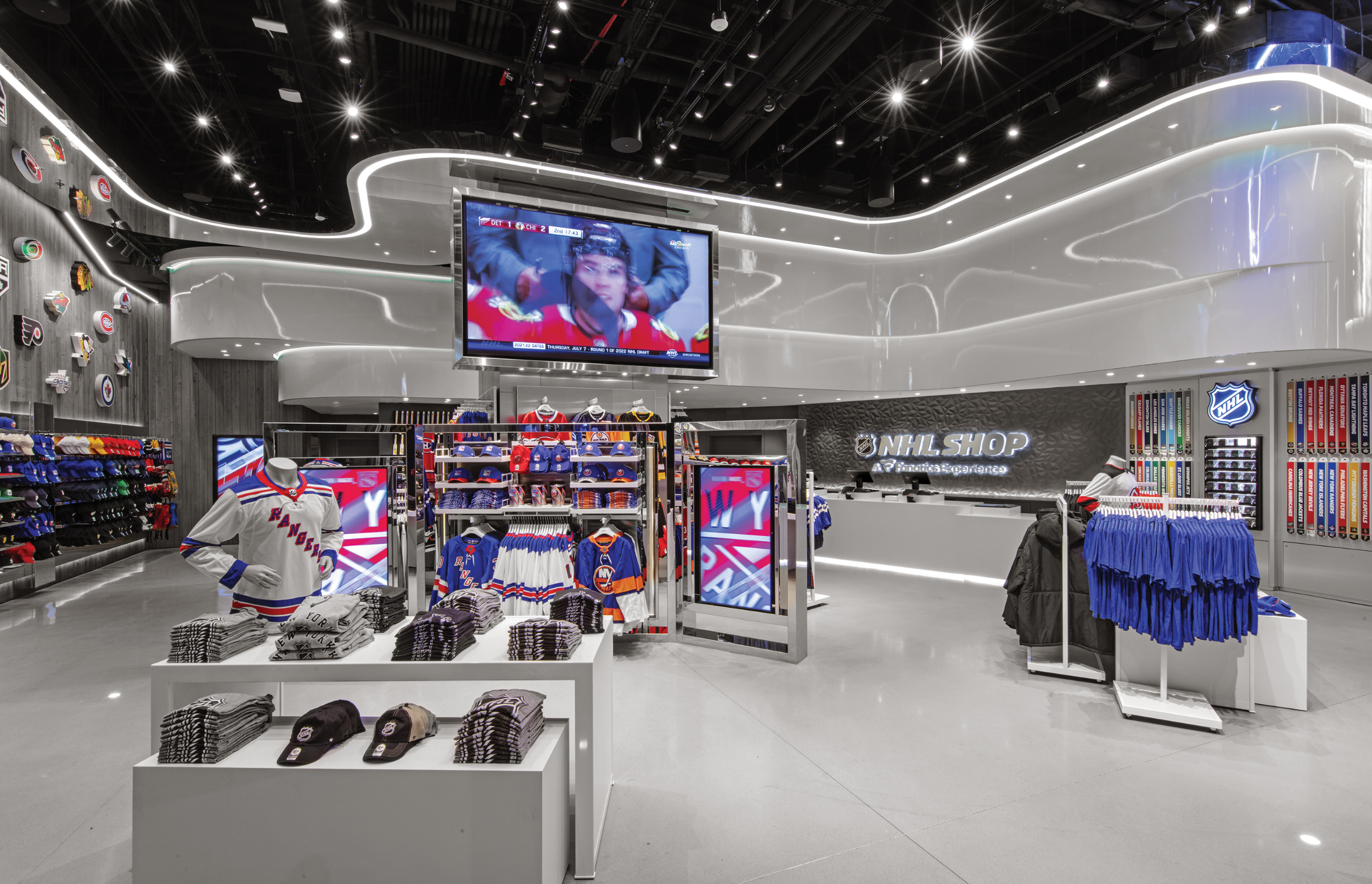 The National Hockey League (NHL) recently debuted its expansive 9000-square-foot store featuring a curvilinear design aesthetic.