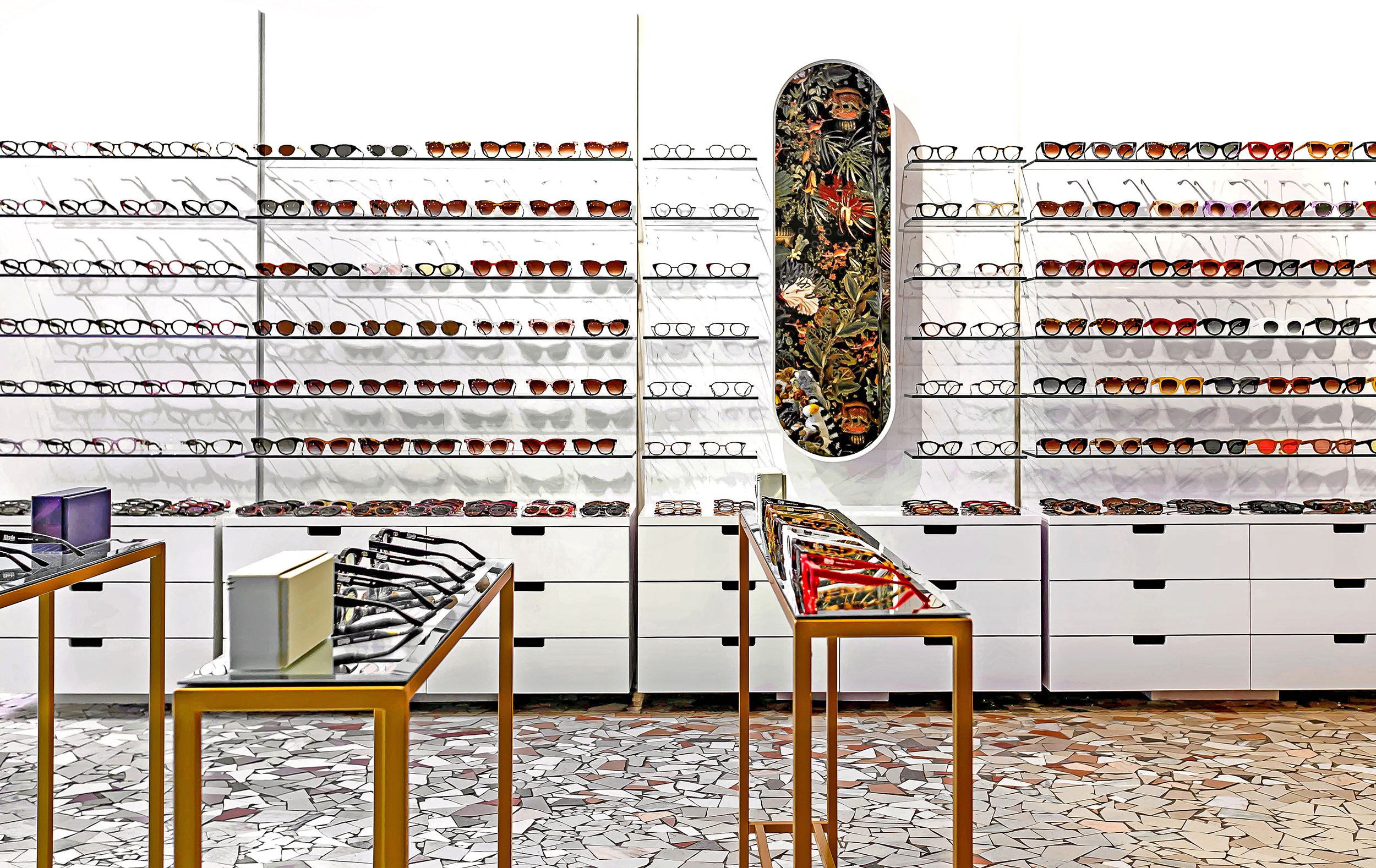 Thierry Lasry’s interior features minimalist fixturing framed by bold wallcoverings and patterns.