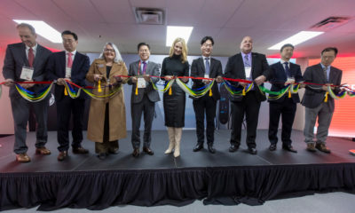 Dignitaries, including Alec Jang, fourth from left, President of the LG Electronics Business Solutions Company and Fort Worth Mayor Mattie Parker, fifth from left, cut the ribbon for the grand opening of LG’s U.S. EV Charger factory on Friday, Jan. 12, 2024, in Fort Worth, TX.
